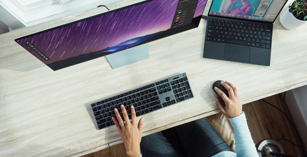 person using laptop on table